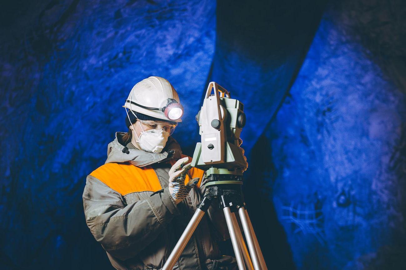 Geologist uses machinery in a cave